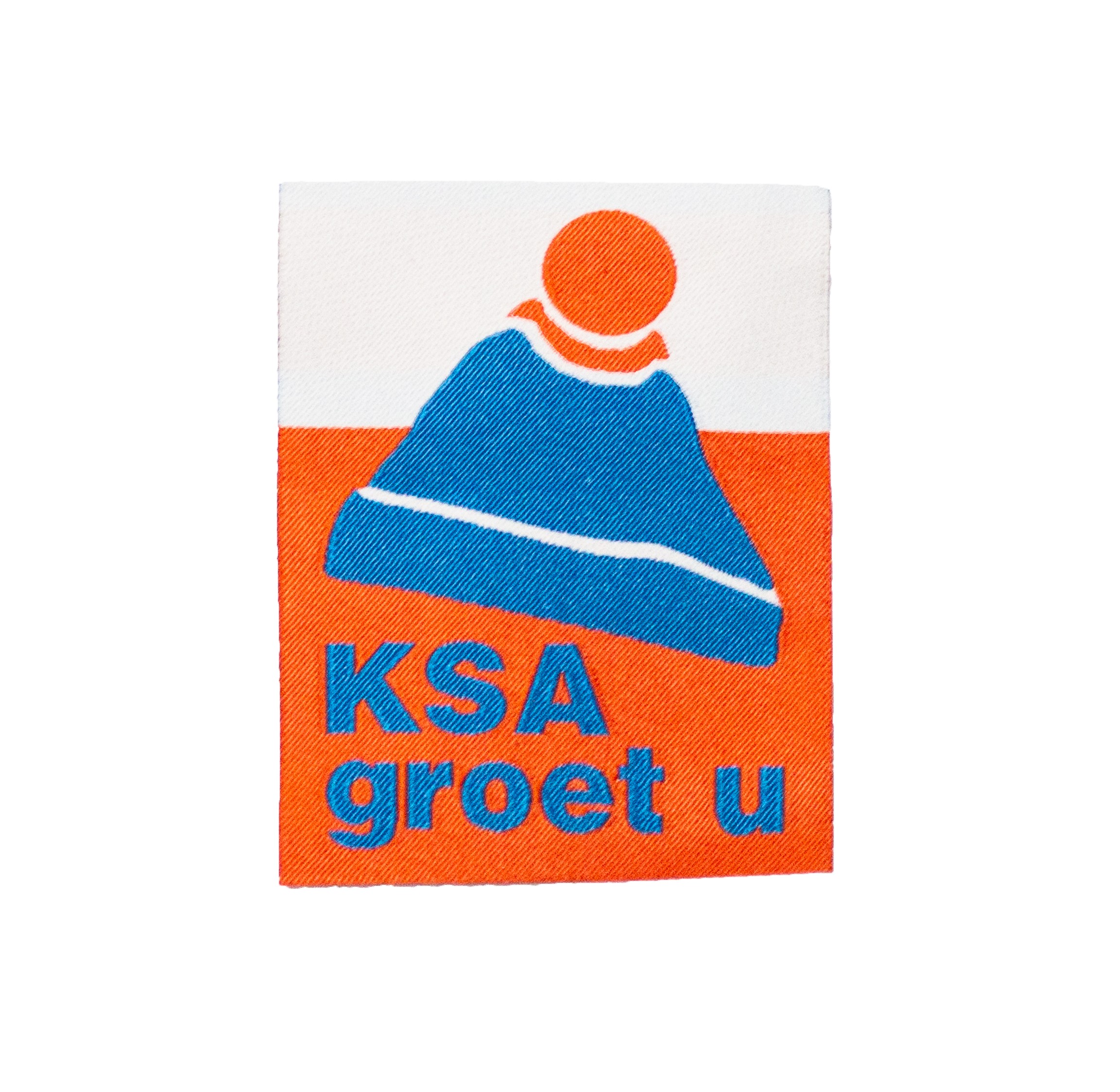 Een foto van het mouwschildje KSA Groet U. 